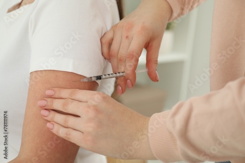 Diabetes. Woman getting insulin injection indoors  closeup