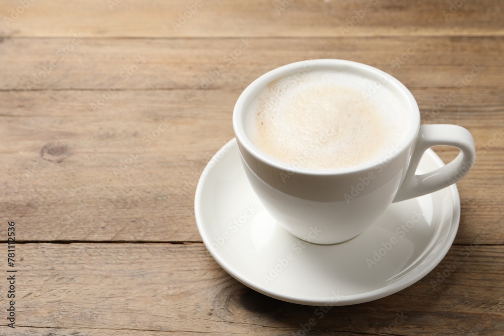 Cup of aromatic coffee on wooden table. Space for text Cup of aromatic coffee on wooden table. Space for text