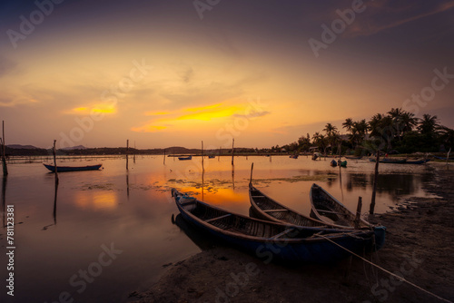 Fototapeta Naklejka Na Ścianę i Meble -  Traditional boats at O Loan lagoon in sunset, Phu Yen province, Vietnam