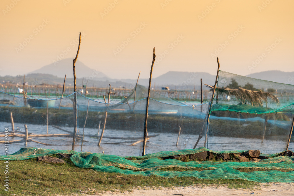 Traditional boats at O Loan lagoon in sunset, Phu Yen province, Vietnam Traditional boats at O Loan lagoon in sunset, Phu Yen province, Vietnam
