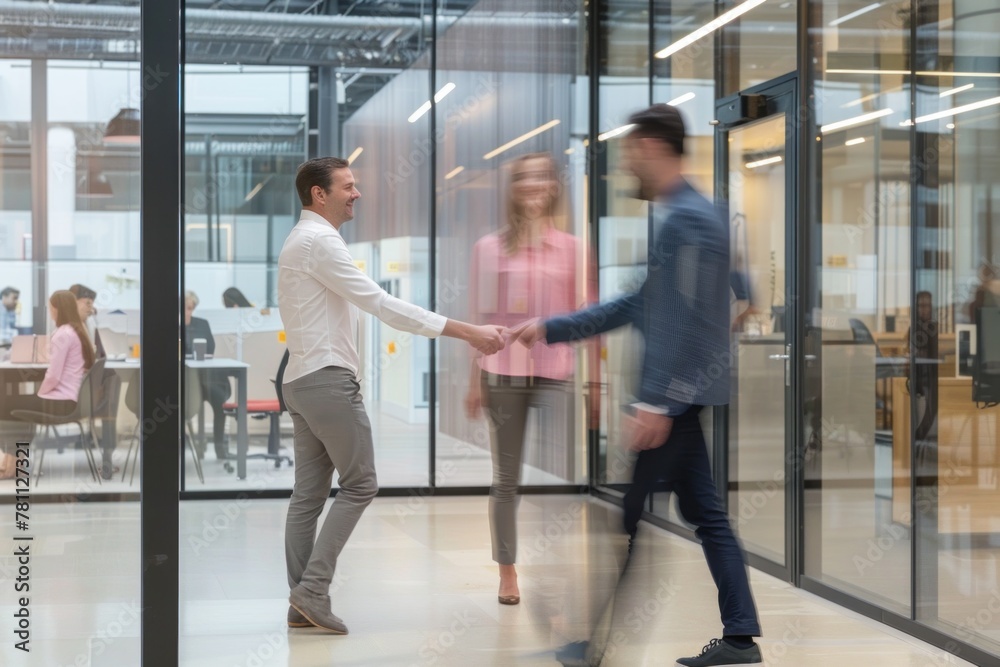 Full body photo of two business people shaking hands in an office setting Full body photo of two business people shaking hands in an office setting