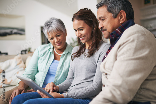 Smile, tablet and woman teaching parents networking on internet, mobile app or website on sofa. Happy, bonding and senior man and woman learning digital technology with female person in living room.