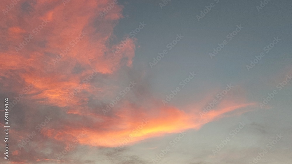 Beautiful orange clouds in the sky at sunset background Beautiful orange clouds in the sky at sunset background