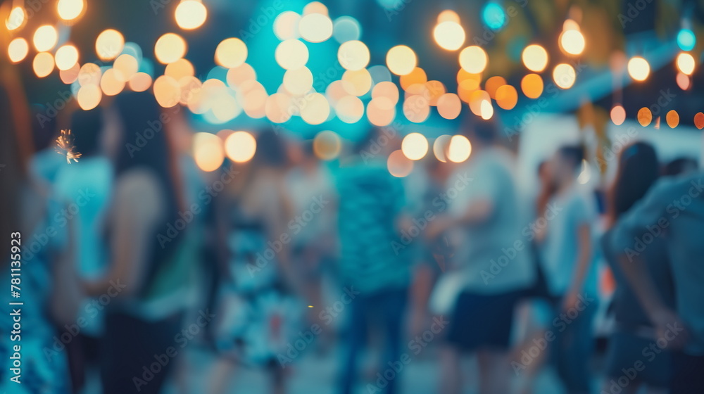 Blurred people at summer party with bokeh lights Blurred people at summer party with bokeh lights