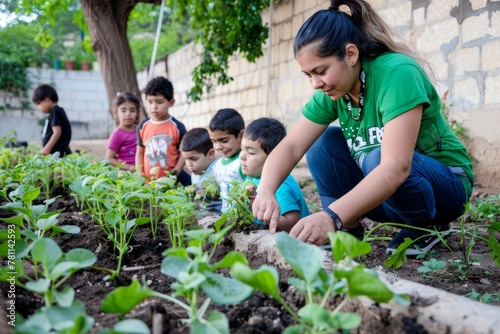 Young Female Teacher and Children Engaging in Outdoor Gardening Activity at Daytime