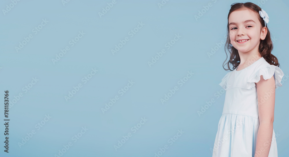 Little girl on a blue background smiling
Little girl on a blue background smiling