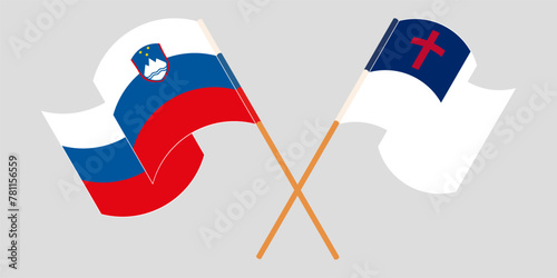 Crossed and waving flags of Slovenia and christianity