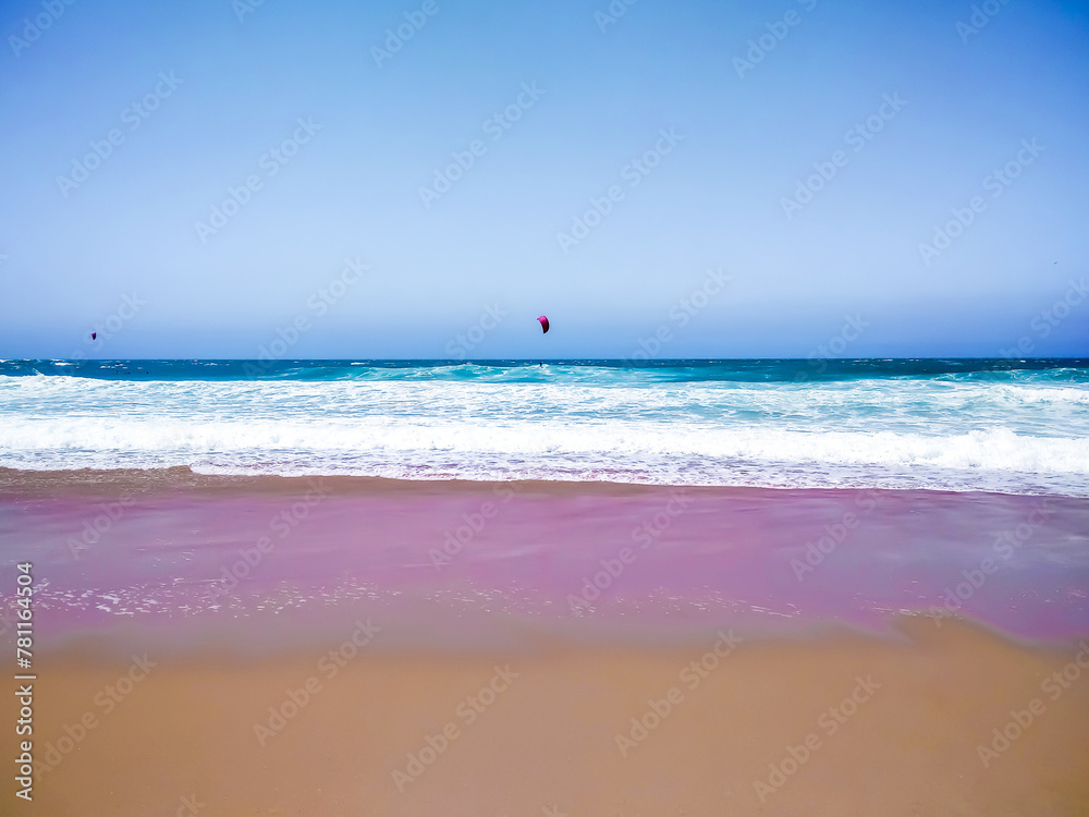 Coast of Portugal. One of the beaches in Cascais with crystal clear water. A great place for water sports - surfing.
