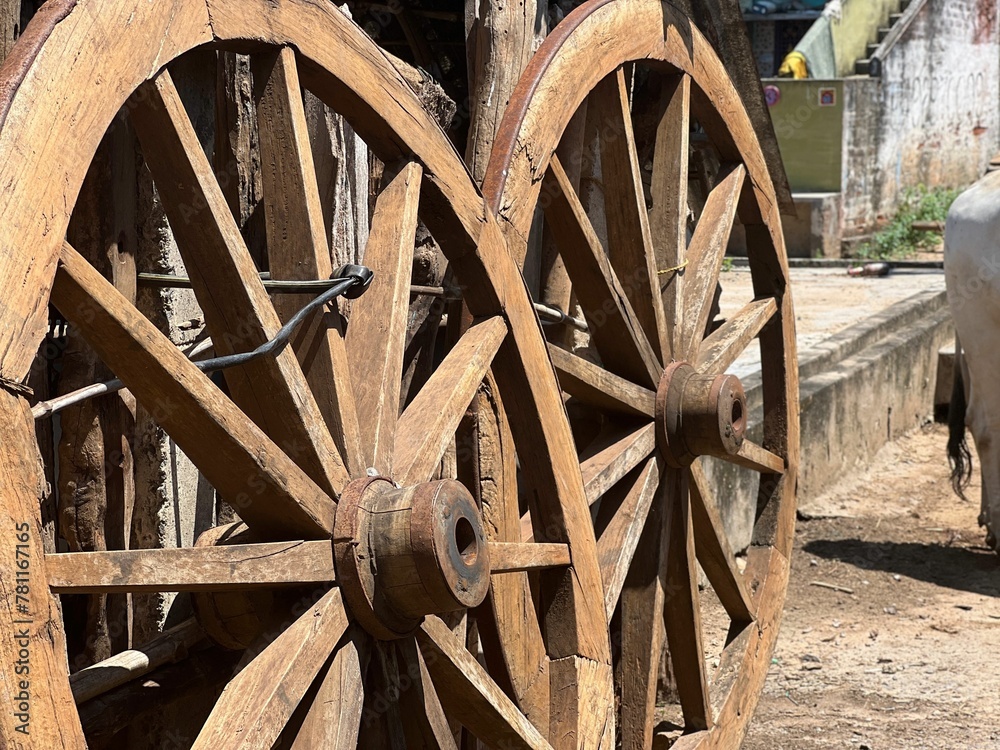 Old wooden decorative wagon wheel in a barn