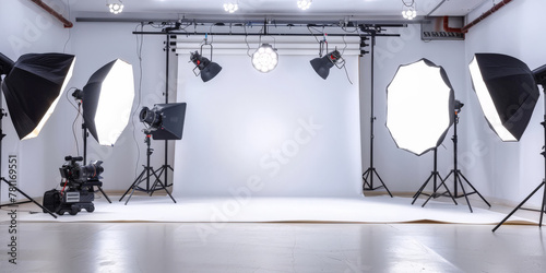  photo studio with lighting and chair, Interior of modern photo studi,   photography studio with white walls, cameras and lighting equipment set up in the background. photo
