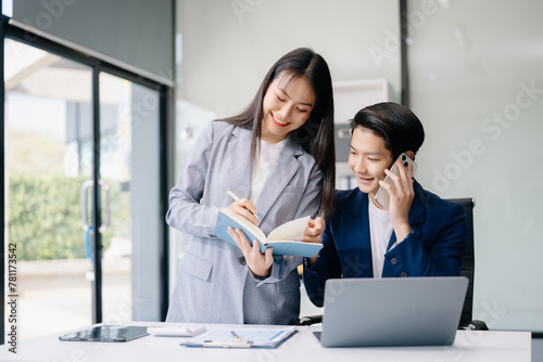 Portrait of success business people working together in office. Couple teamwork startup concept.