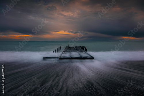 long exposure on the beach with dramatic sky view of the antalya photo