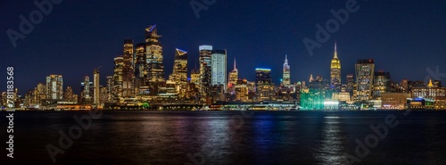 Panoramic view of the New York City Manhattan skyline illuminated with lights