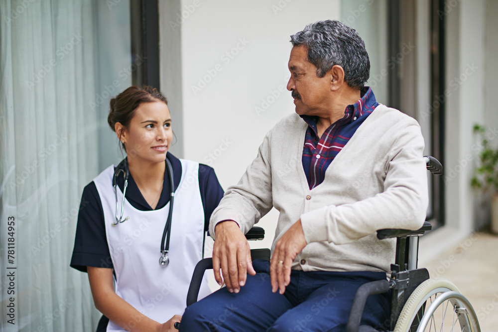 Elderly, nurse and person a disability in wheelchair with support, caregiver and help in retirement. Senior, man and woman with kindness outdoor at nursing home and talk about healthcare or service