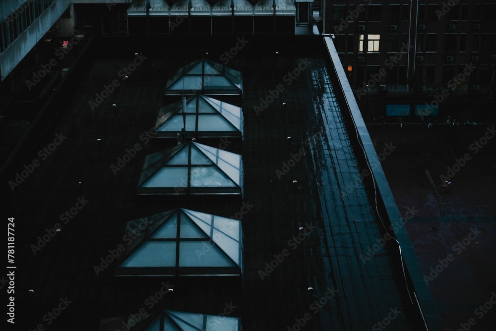 Aerial view of building roof during rain Aerial view of building roof during rain