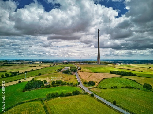 Aerial shot of Emley Moor transmitting station and cultivated fields around in England photo