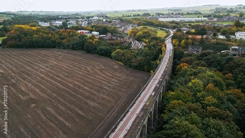 Drone footage of Penistone Railway bridge near Barnsley, Showing a ploughed field and woodlands photo