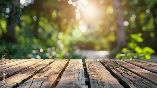 Mockup wooden board surface in the garden with blurred nature background.