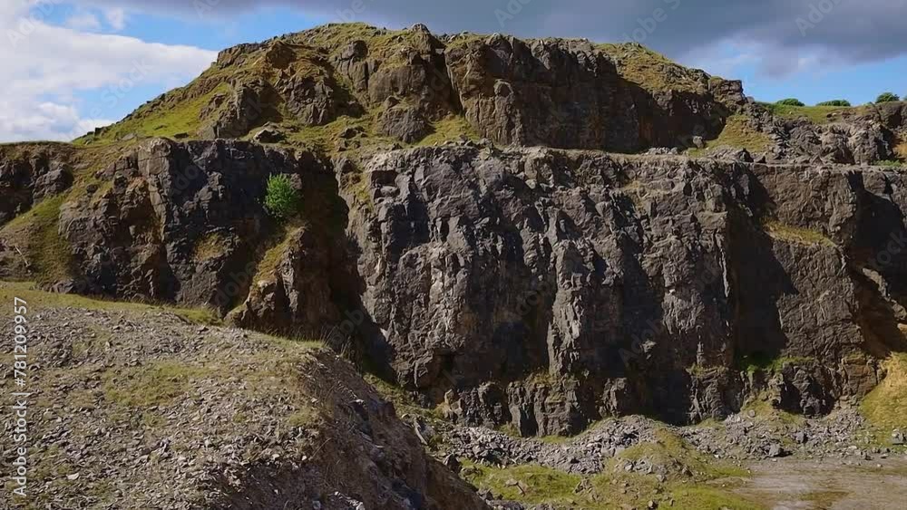 Drone view of a valley surrounded by rough rocky during daytime Drone view of a valley surrounded by rough rocky during daytime