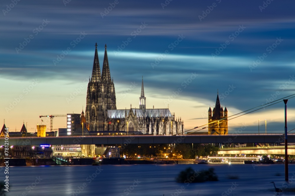 Cologne Cathedral on blue cloudy sunset sky background in Germany, long exposure