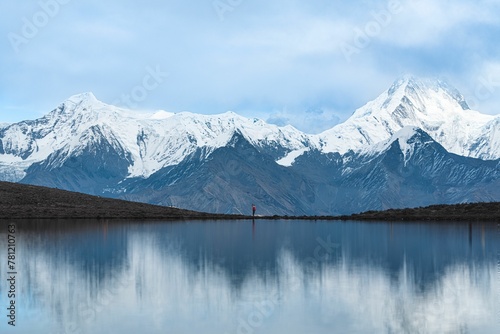 Beautiful shot of a lake surrounded by mountains under the clouds