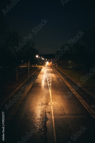 Vertical shot of an empty highway during a nighttime