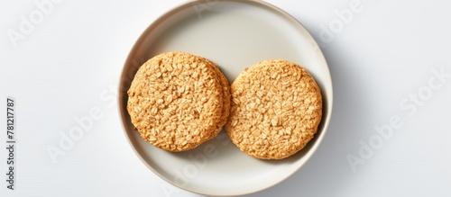 Plated cookies on white sur...