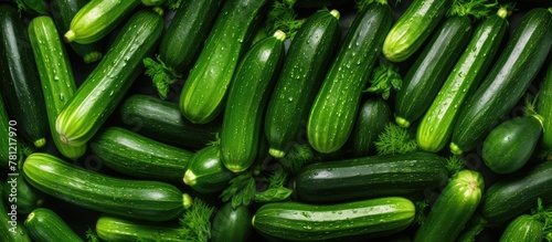 Pile of fresh cucumbers wit...