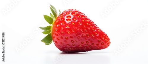 Single strawberry with leaf...