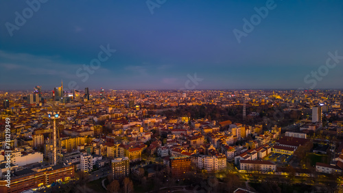 Urban skyline of Italian metropolis at sunset. Italy, Lombardy, Milan. Copy space.