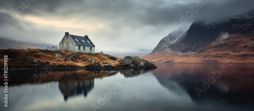House on a solitary isle in the midst of a pond photo