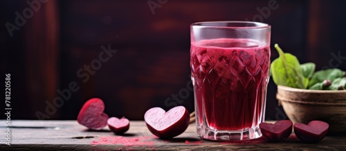Glass of beet juice and bow...
