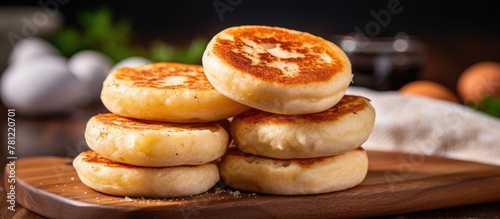 A stack of flapjacks on a wooden board