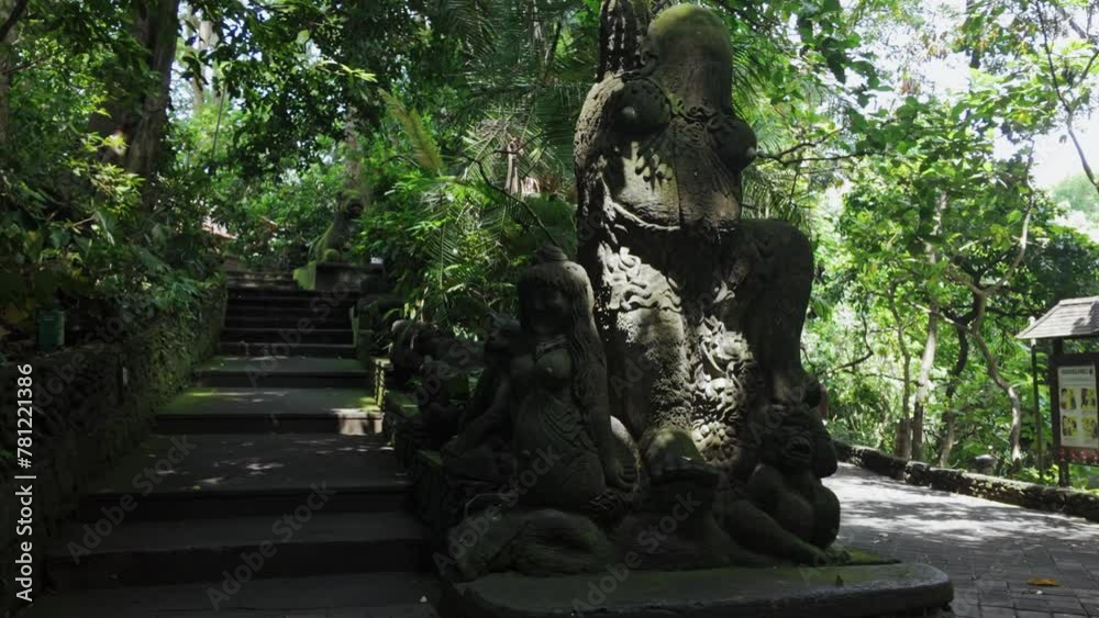 Statues and walking path in the Monkey Forest, Ubud, Bali, Indonesia. Statues and walking path in the Monkey Forest, Ubud, Bali, Indonesia.