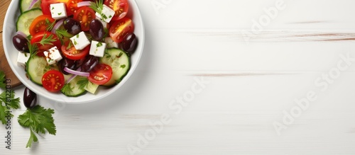 Greek salad in white bowl t...