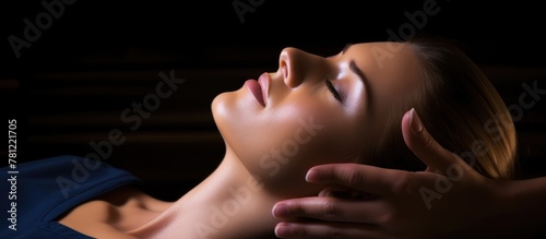 Woman receiving facial mass...