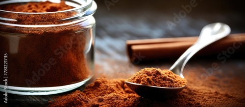 Spoon with powder by cinnam...