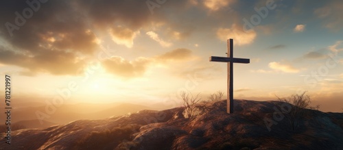 Empty cross on a hill at dusk