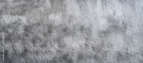 White fuzzy carpet against ...