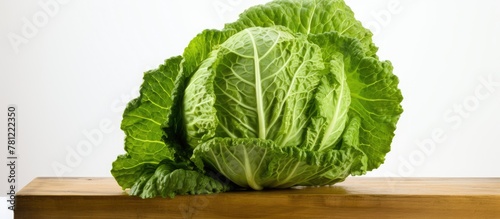 Half cabbage on wooden surface