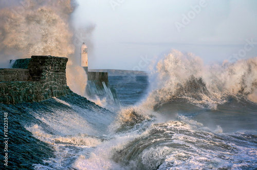 Porthcawl lighthouse getting battered by a combination of a high tide and Storm Kathleen in South Wales UK photo