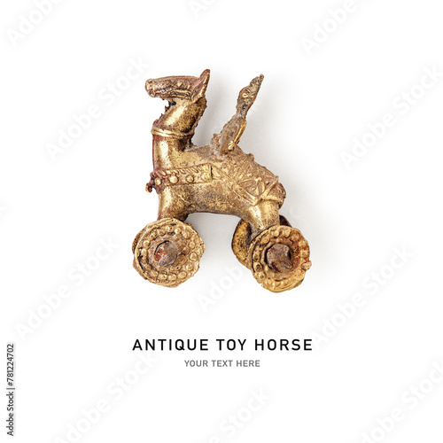 Vintage toy horse on wheels with knight isolated on a white background.