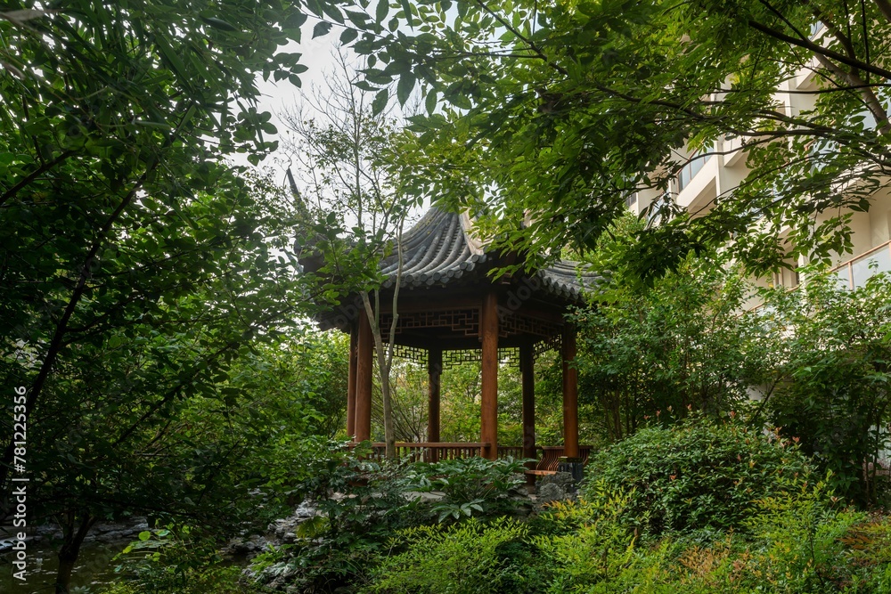 Wooden pavilion in a green park in china Wooden pavilion in a green park in china