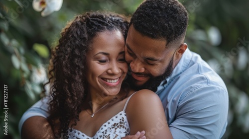 A happy couple sharing a tender moment after getting engaged, lost in each other's embrace.