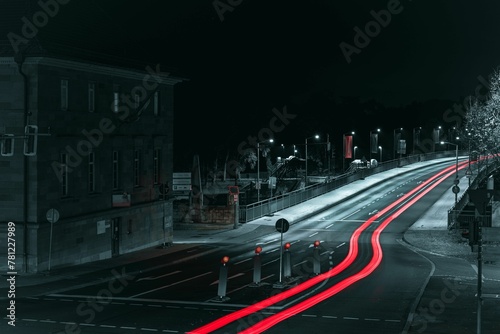 Long exposure of red lights of the car driving on the Maxbrucke bridge in Nuremberg at night