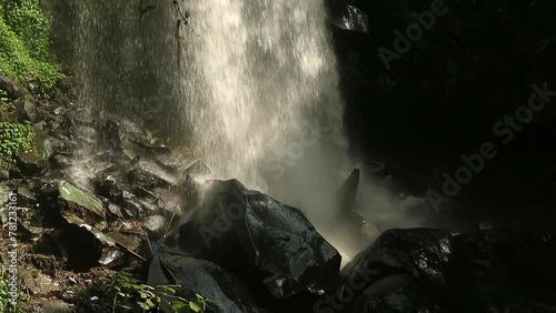 Coban Lanang, small waterfall in Malang East Java Indonesia, seamless video loop, fresh natural landscape for healing photo