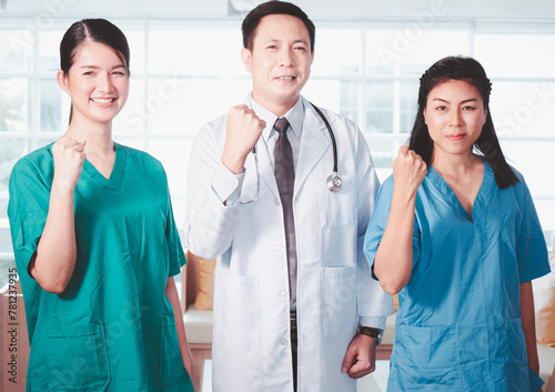 Portrait of a group of medical staff poses to give confidence and looking togrther in the hospital boardroom.. photo