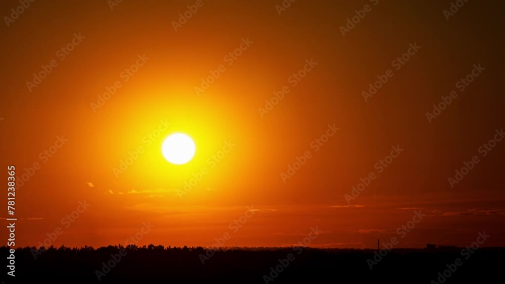 Time lapse of sunset orange golden sun on a cloudy sky. Clouds against the sky during the golden hour of sunrise or sunset. Beautiful sunset of the day. Time lapse of sunset orange golden sun on a cloudy sky. Clouds against the sky during the golden hour of sunrise or sunset. Beautiful sunset of the day.