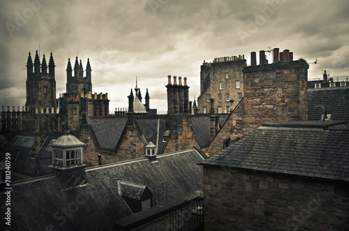 View of classic medieval roofs and chimney tops of the city of Edinburgh, Scotland.