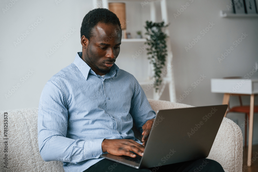 Freelancer is working at home by laptop Freelancer is working at home by laptop